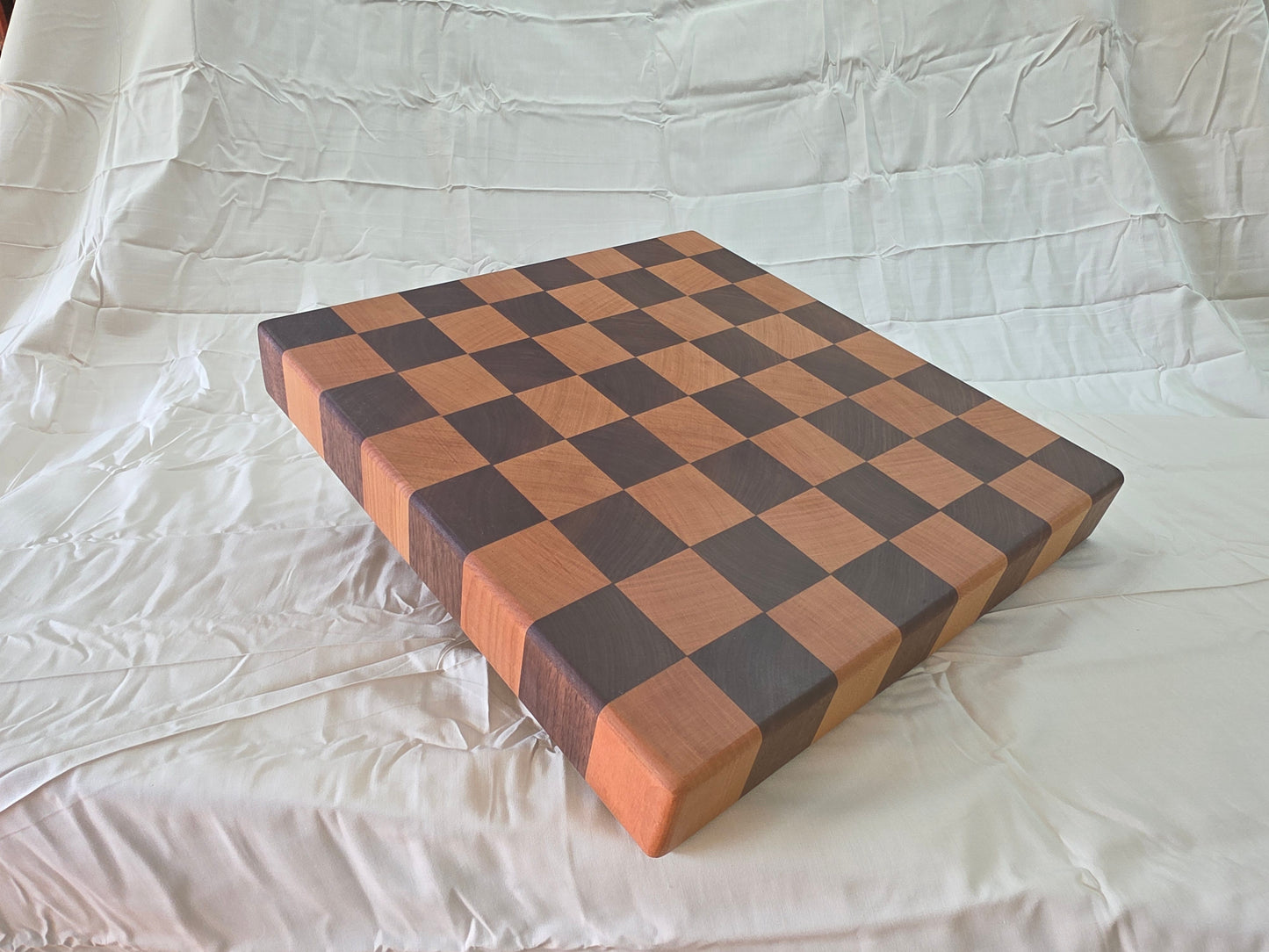 Handmade black walnut cherry end grain cutting board side view