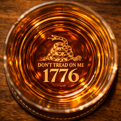 Bottom of whiskey glass featuring Gadsden snake and 1776