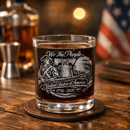 Clear whiskey glasses with engraved patriotic artwork featuring a Colonial Soldier, Liberty Bell, and Bald Eagle