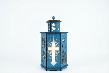 Blue wooden religious tea light lantern featuring a glowing laser-cut Christian cross, Holy Spirit dove, and Nativity scene.